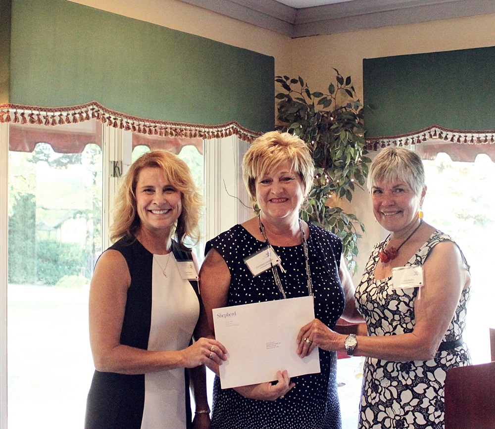 Panhandle Home Health, Inc. Executive Director Lisa Bivens (l) and Director of Development Christina Johnson (m) receive the WISH nonprofit grant from Grants Committee Vice-Chair Carol Kable (r)